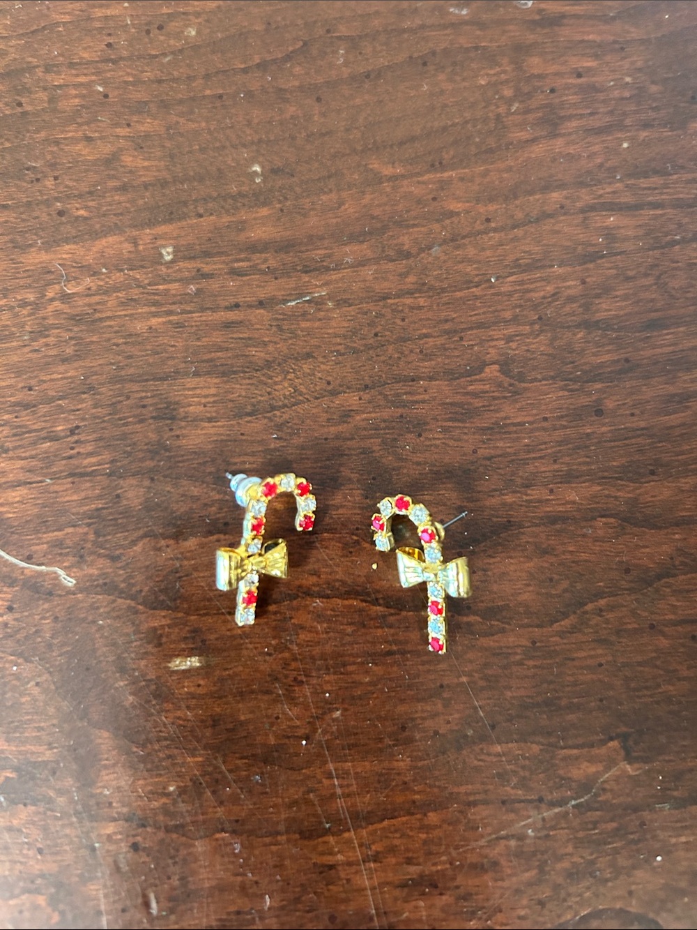 Source Unknown Gold Candy Cane Bow Earrings with Red and Green Stones